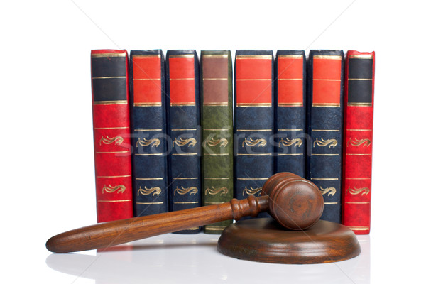 Stock photo: Wooden gavel and old law books