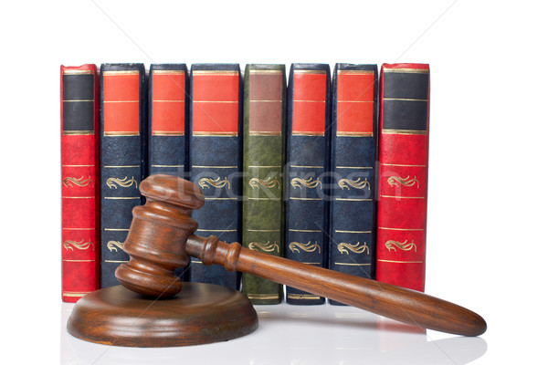 Wooden gavel and old law books Stock photo © broker