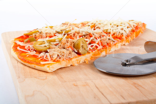 Detail of slices Italian pizza and cutter Stock photo © broker