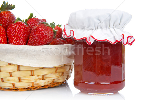 Jam jar and basket of strawberries Stock photo © broker