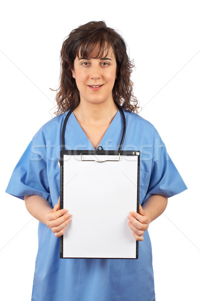 Female doctor showing a blank clipboard Stock photo © broker