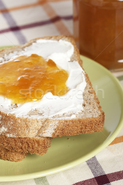 Ontbijt toast boter perzik jam glas Stockfoto © broker
