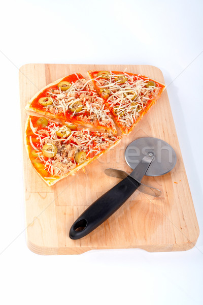 Slices of Italian pizza and cutter Stock photo © broker