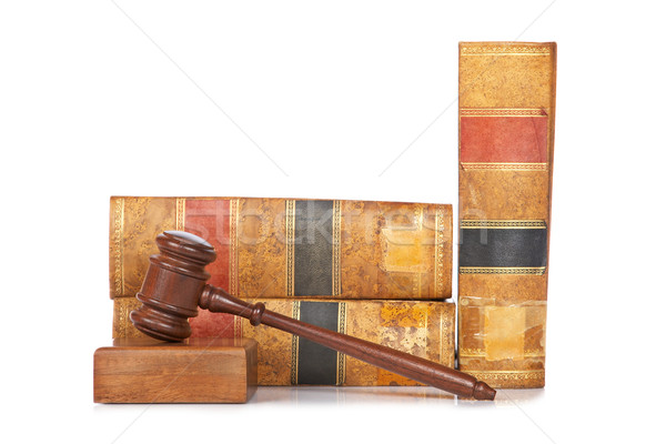 Wooden gavel and old law books Stock photo © broker