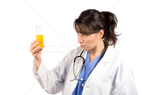 Female doctor examining test flasks Stock photo © broker