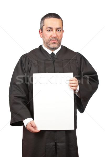 Stock photo: Serious judge holding the blank card