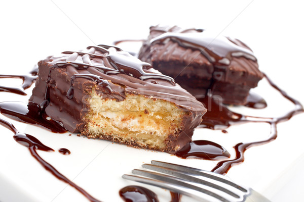 Two chocolate cakes with syrup and the fork Stock photo © broker