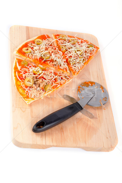 Slices of Italian pizza and cutter.  Macro shot on white background Stock photo © broker