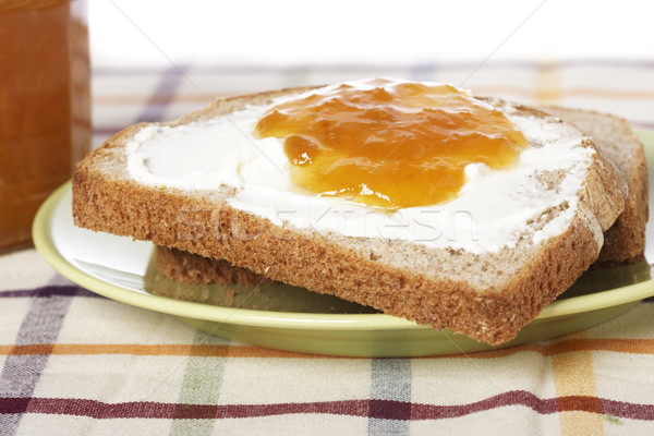 Ontbijt toast boter perzik jam glas Stockfoto © broker