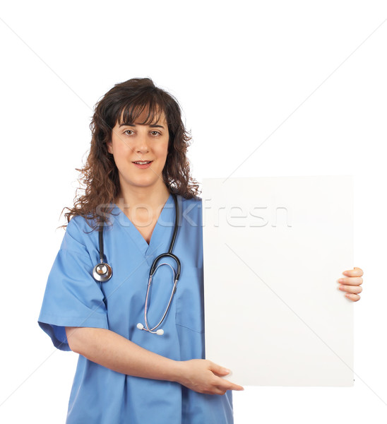 Female doctor holding the blank placard Stock photo © broker