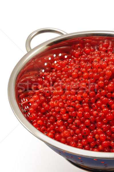 Fresh red currant berries with water drops in colander - isolated Stock photo © brozova