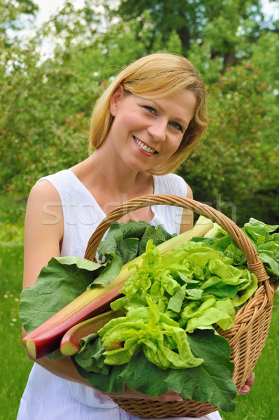Young woman holding basket with vegetable Stock photo © brozova