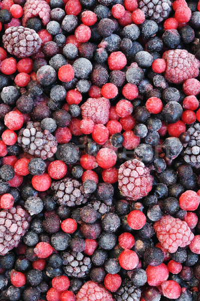 Stock photo: Close up of frozen mixed fruit  - berries - red currant, cranberry, raspberry, blackberry, bilberry,