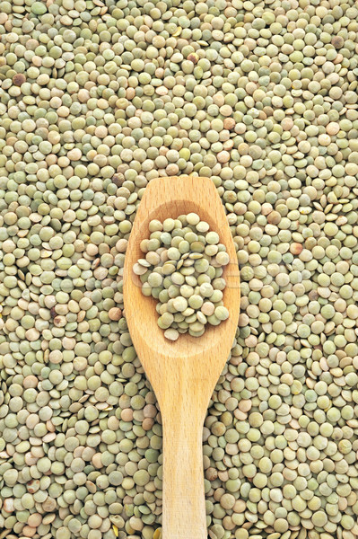 Wooden spoon and dried green lentils Stock photo © brozova