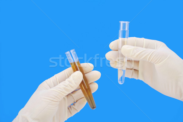 Clean and dirty water samples in hands Stock photo © brozova