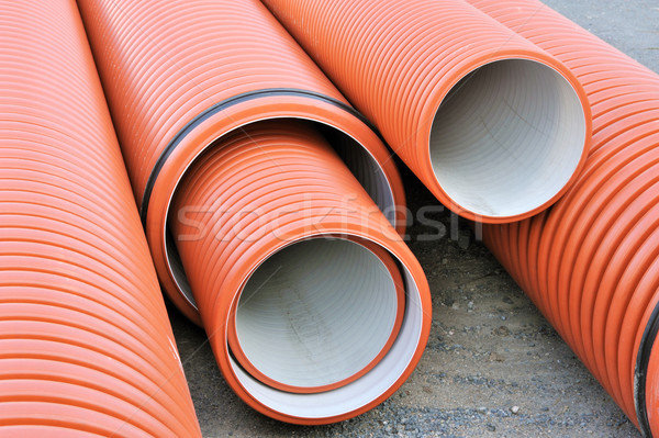Stock photo: Plastic drainage pipes stacked - sewage conduit