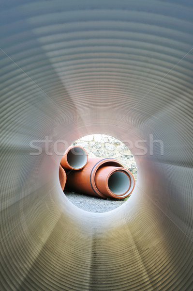 Stock photo: Inside of plastic tube. View on pipes stack.