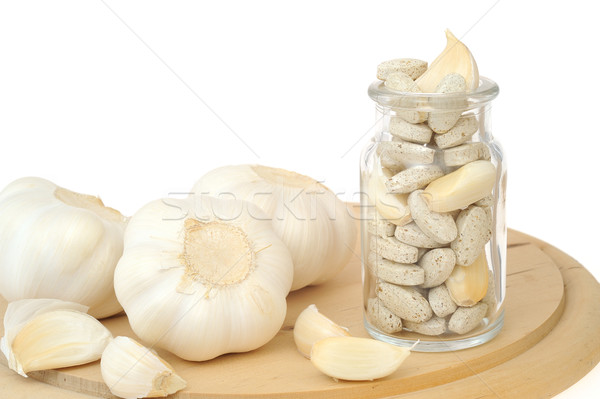 Garlic and herbal supplement pills isolated, alternative medicine concept Stock photo © brozova