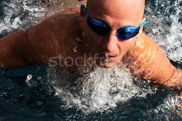 Stock photo: Detail of young man swimming