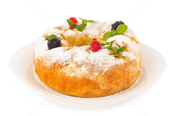 Sweet pie with fresh berry and leaf of mint on ceramic plate. Stock photo © brulove