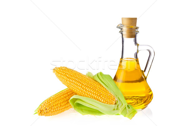 Decanter with farm organic vegetable oil and pair juicy corn cob Stock photo © brulove