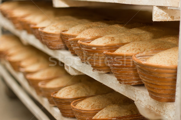 Proving dough of bran in basket. Private Bakery.  Stock photo © brulove