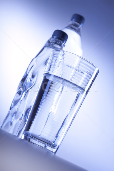 Stock photo: Drinking water in bootles and cup