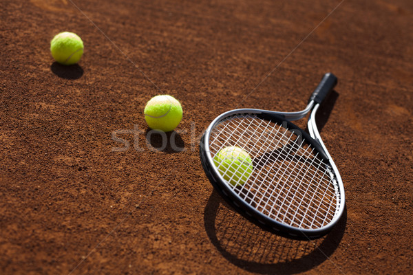 Tennis balls and rocket on court field Stock photo © BrunoWeltmann