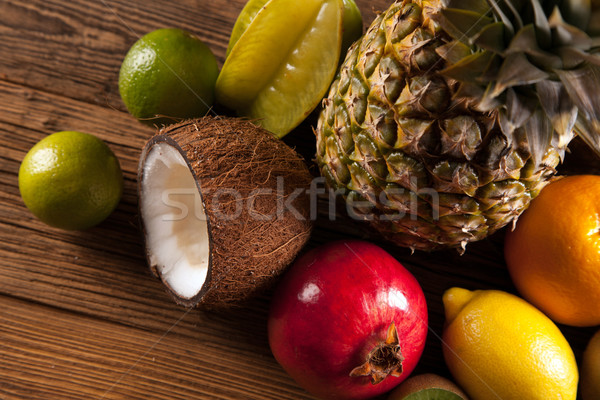 Super tasty tropical fruits on wooden table Stock photo © BrunoWeltmann
