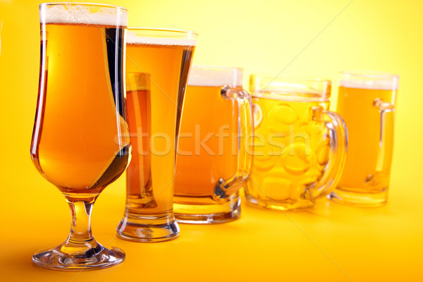 Chilled beer on yellow background Stock photo © BrunoWeltmann