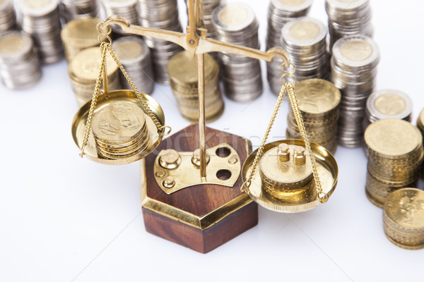 A lot of money! Coins on scales Stock photo © BrunoWeltmann