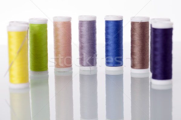 Sewing equipment and  threads on white background. Stock photo © BrunoWeltmann
