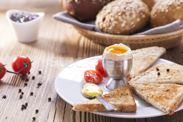 Soft-boiled egg in the morning with pepper, tomatoes and crouton Stock photo © BrunoWeltmann