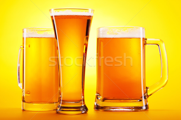 Chilled beer on yellow background Stock photo © BrunoWeltmann