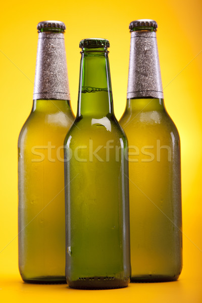 Chilled beer on yellow background Stock photo © BrunoWeltmann