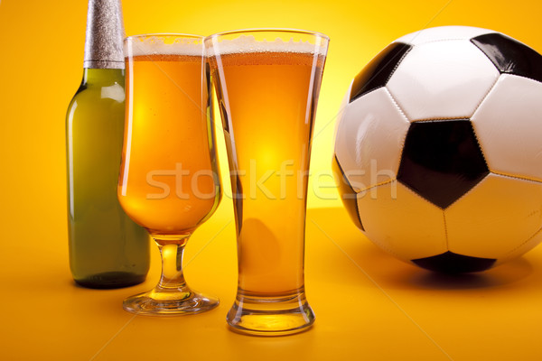 Chilled beer on yellow background Stock photo © BrunoWeltmann