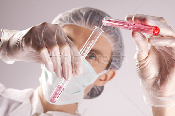 Scientist experimenting with colorfull fluids Stock photo © BrunoWeltmann
