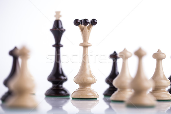Stock photo: chess pieces on glass