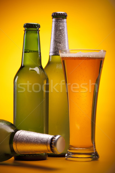 Chilled beer on yellow background Stock photo © BrunoWeltmann