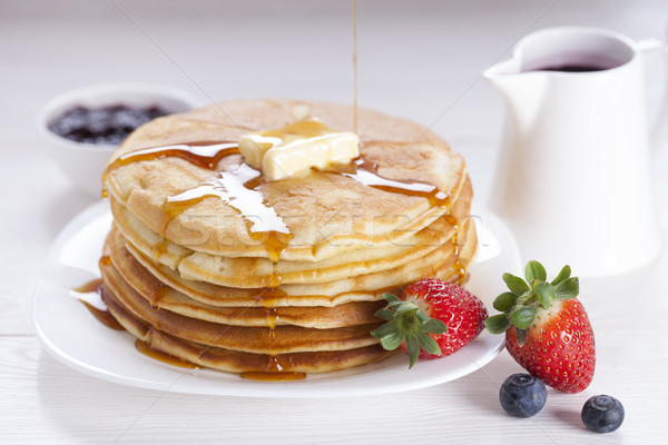 Stock photo: Delicious sweet American pancakes on a plate with fresh fruits