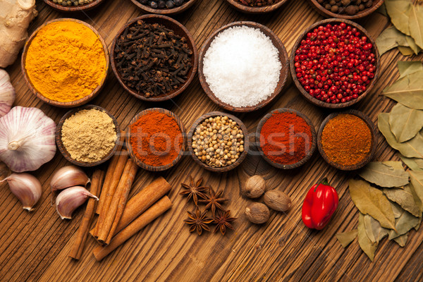 Fűszer különböző színes fa asztal tálak étel Stock fotó © BrunoWeltmann