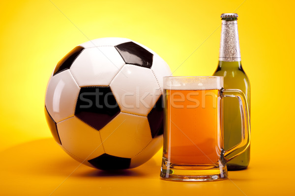 Chilled beer on yellow background Stock photo © BrunoWeltmann