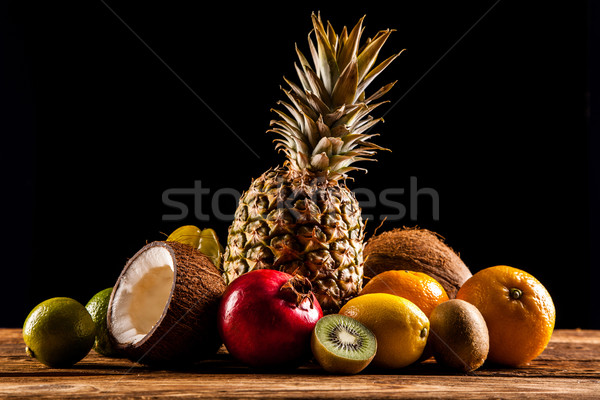 Super tasty tropical fruits on wooden table Stock photo © BrunoWeltmann