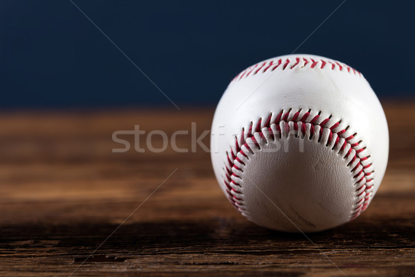 Baseball ball on wooden table Stock photo © BrunoWeltmann