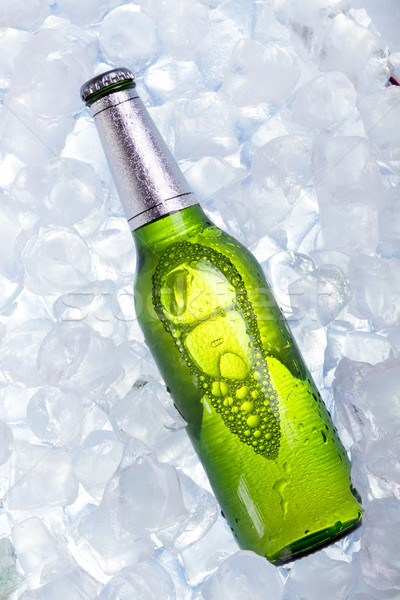 Stock photo: Cold beer in ice