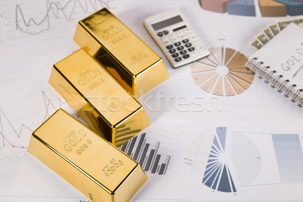 Gold bars on graphs and statistics Stock photo © BrunoWeltmann
