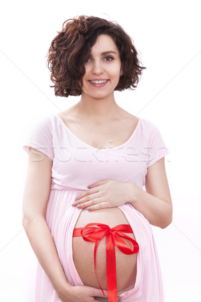 Stock photo: Pregnant woman expects baby. Excellent gift