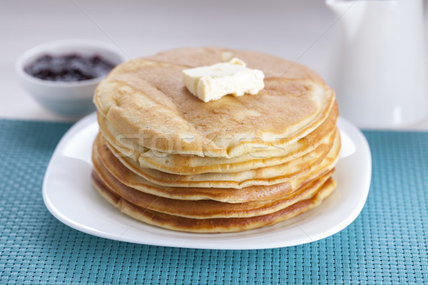 Delicious sweet American pancakes on a plate with fresh fruits Stock photo © BrunoWeltmann