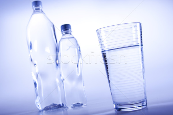 Stock photo: Drinking water in bootles and cup