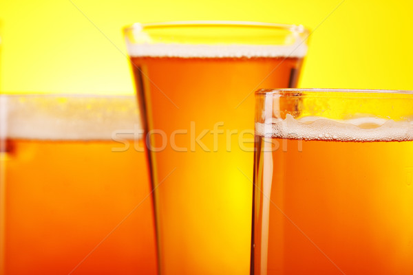 Chilled beer on yellow background Stock photo © BrunoWeltmann